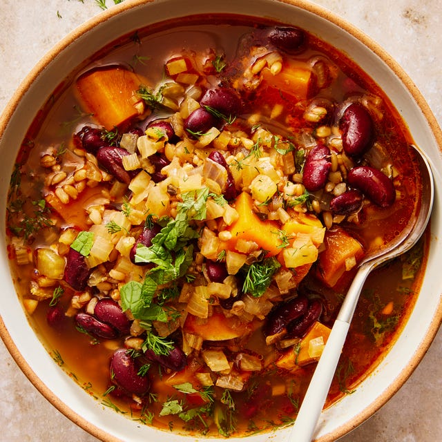 Hearty Red Bean and Barley Stew red bean and barley stew in a bowl topped with fresh herbs