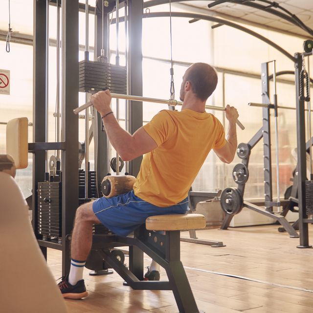 https://hips.hearstapps.com/hmg-prod/images/one-young-man-sport-clothes-back-lat-pulldown-royalty-free-image-1636375894.jpg?crop=0.66635xw:1xh;center,top&resize=640:*