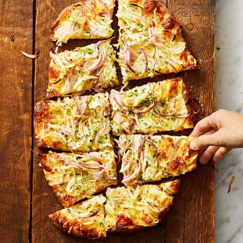 onion flatbread on a wooden table onion flatbread on a wooden table