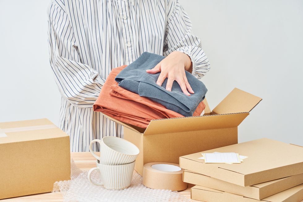 online flea market concept with cardboard boxes and packing supplies – a lifestyle image