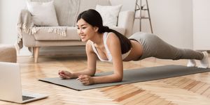 Online Training. Girl Exercising at Home, Doing Plank