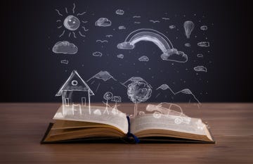 open book with hand drawn landscape