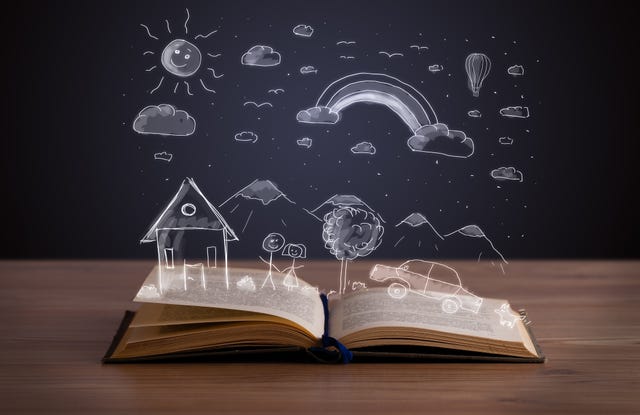 open book with hand drawn landscape