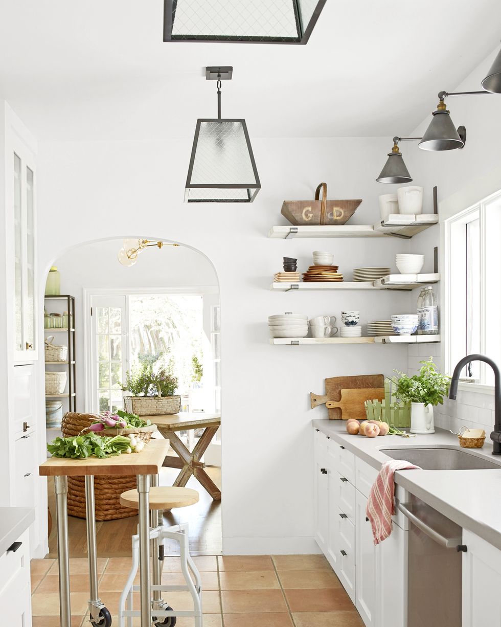 white kitchen in small spanish style california cottage