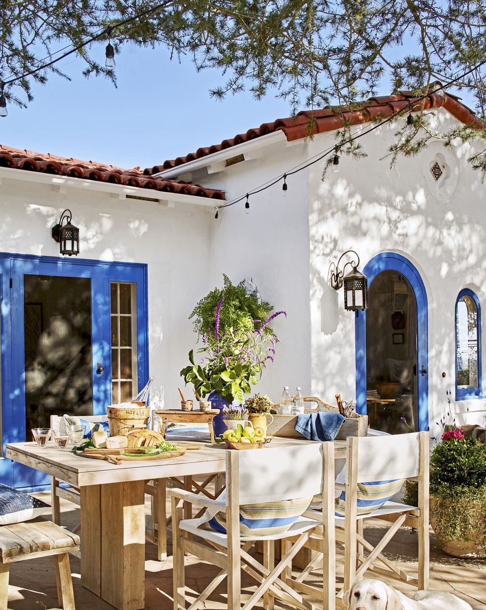 outdoor dining space of small spanish style california cottage