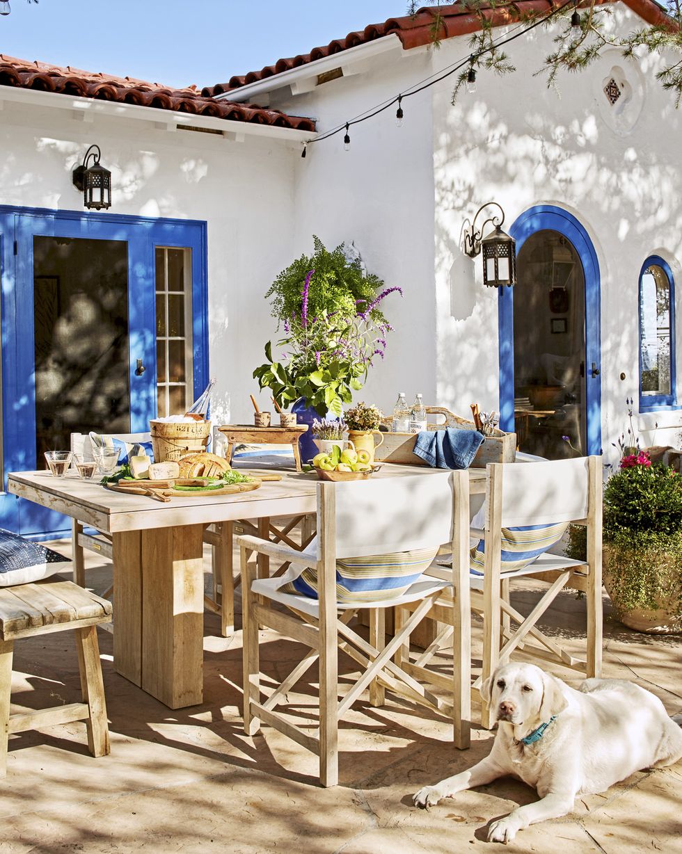 outdoor dining space of small spanish style california cottage