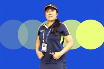 susan yeun stands in her us open ball girl outfit with blue and yellow background