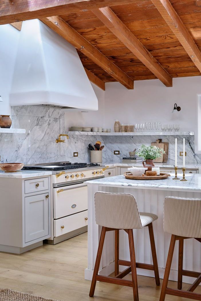 marble white kitchen with same color open shelves