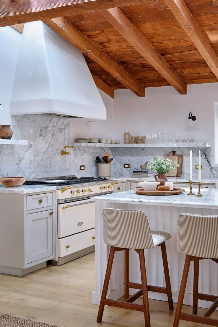 marble white kitchen with same color open shelves