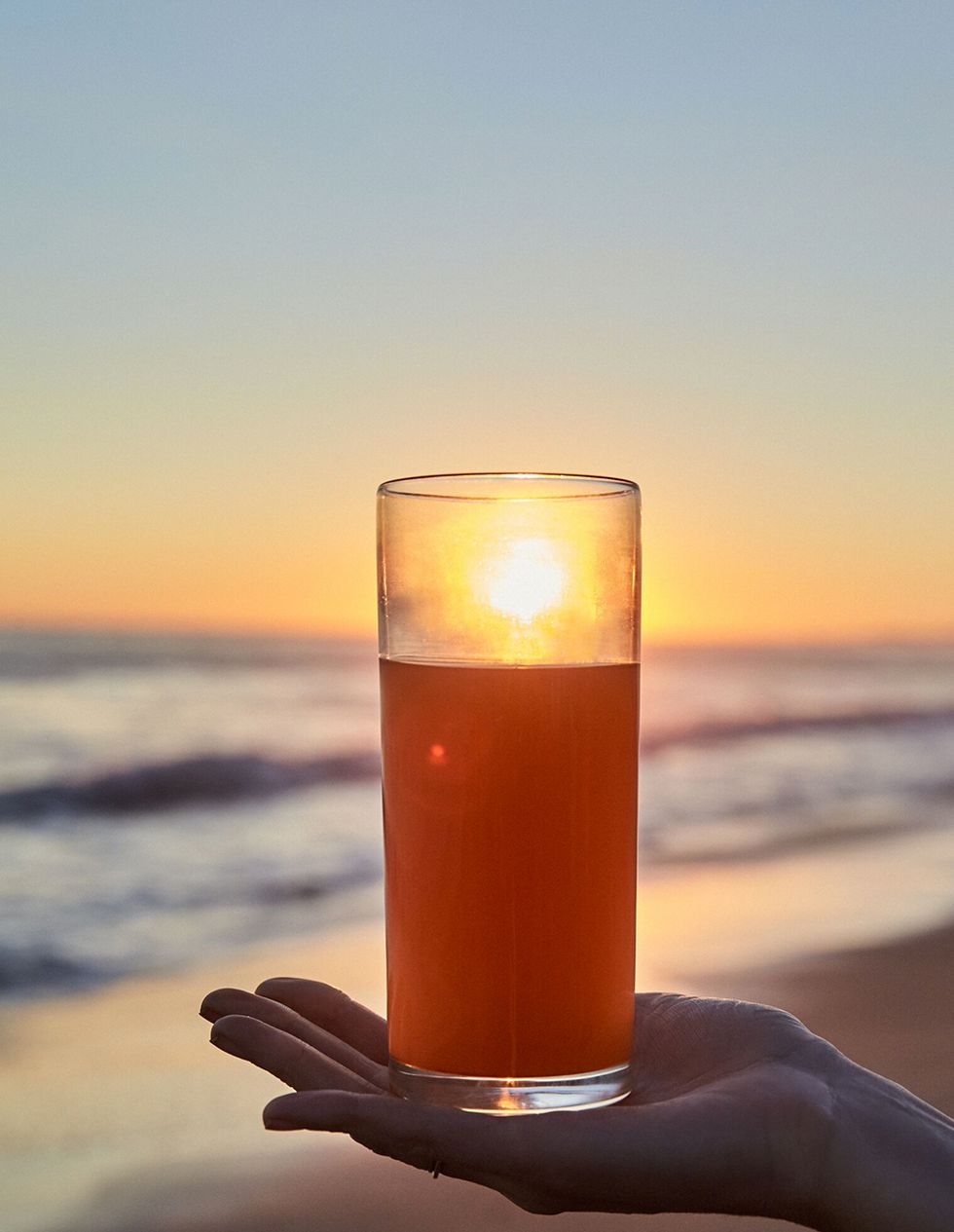 Drink, Sky, Lighting, Alcoholic beverage, Lager, Candle, Calm, Sunset, Beer, Pint glass, 