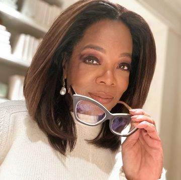 oprah holding a pair of eyeglasses
