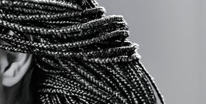 close up of afro pigtails braids in zizi and kanekalon technique with multi colored threads and dreadlocks