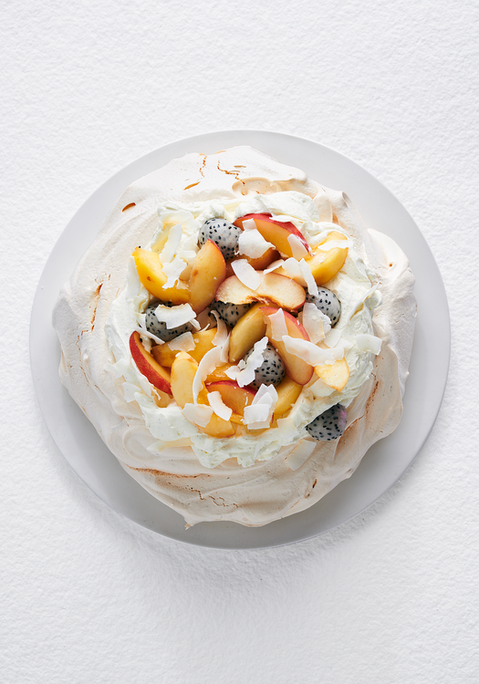 pavlova with vanilla cream, white dragon fruit, and nectarines