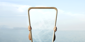 surreal image of a transparent mirror concept of door to freedom