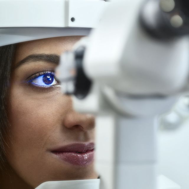 Optician, Young woman during eye test