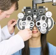 vision care loss dementia study optometrist examining patient with phoropter