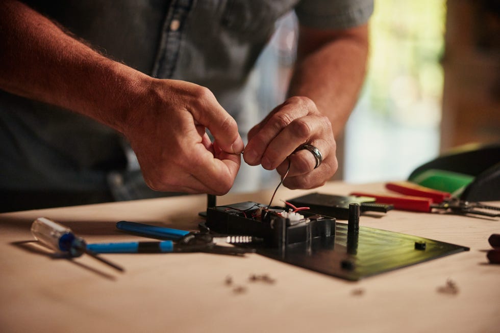 a person working on a circuit board