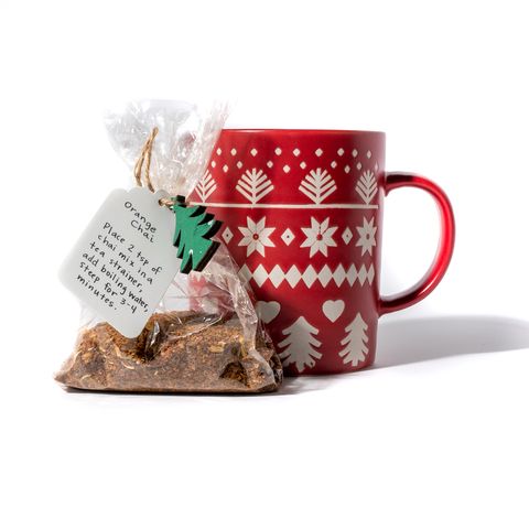 orange scented chai tea mix next to a mug, edible gifts