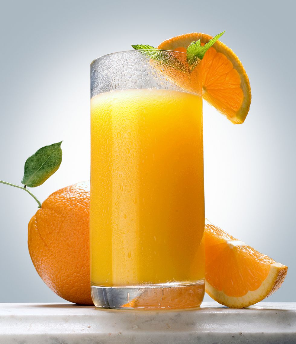 orange juice on marble ledge