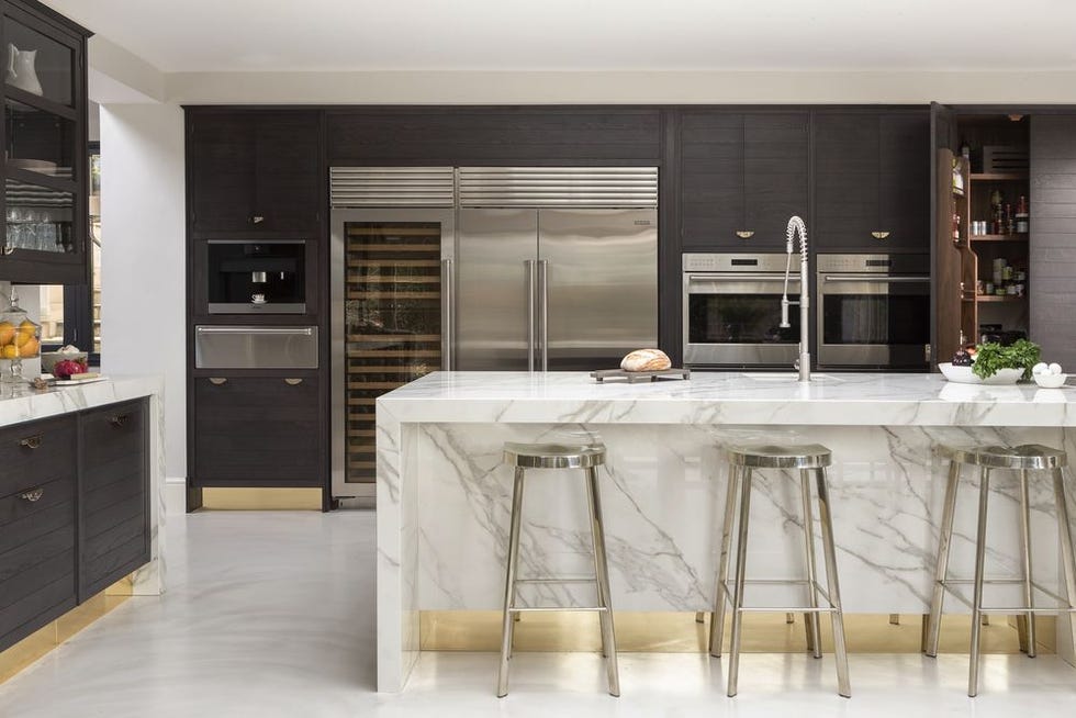white marble and brass details kitchen by smallbone