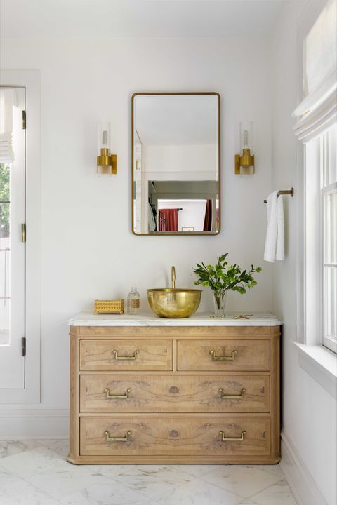 main bathroom, wooden cabinet with white marble countertop, gold sink with gold faucet