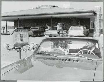 family orders food at drivein restaurant
