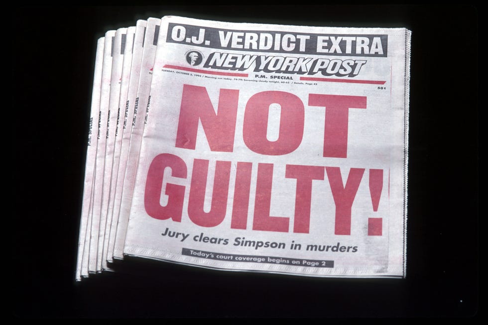 a stack of newspapers with the phrase not guilty in red letters followed by the statement jury clears simpson in murders