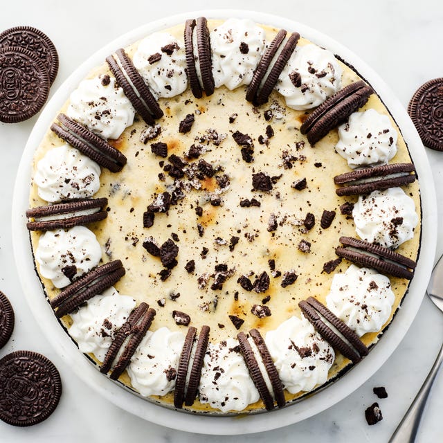 oreo cheesecake topped with whipped cream and oreos