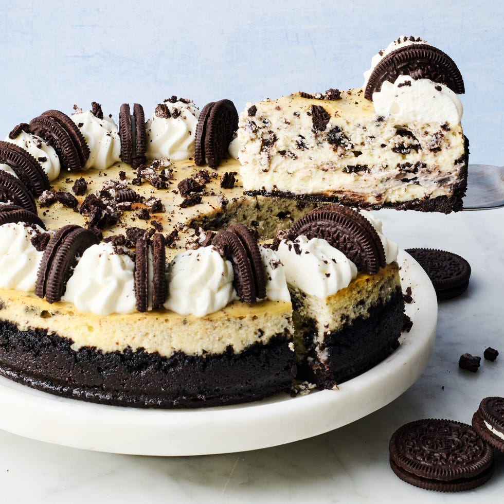 oreo cheesecake topped with whipped cream and oreos