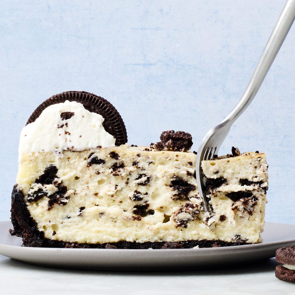 oreo cheesecake topped with whipped cream and oreos