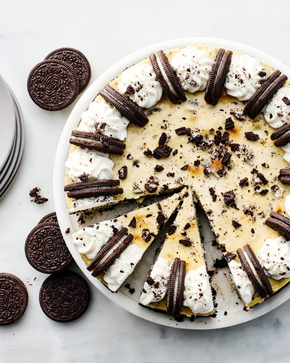 oreo cheesecake topped with whipped cream and oreos