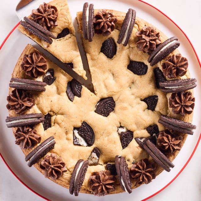cookie cake with oreos mixed in and on top with chocolate frosting