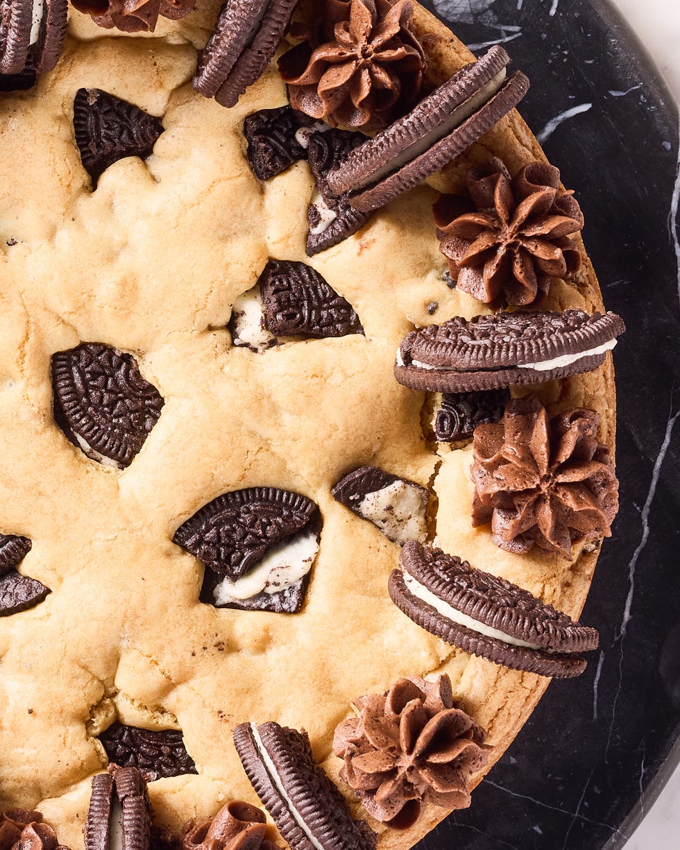 cookie cake with oreos mixed in and on top with chocolate frosting