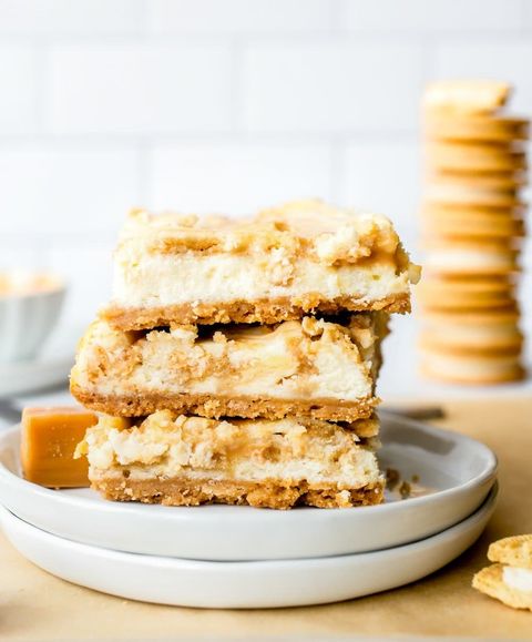 golden oreo cheesecake bars stacked on plates