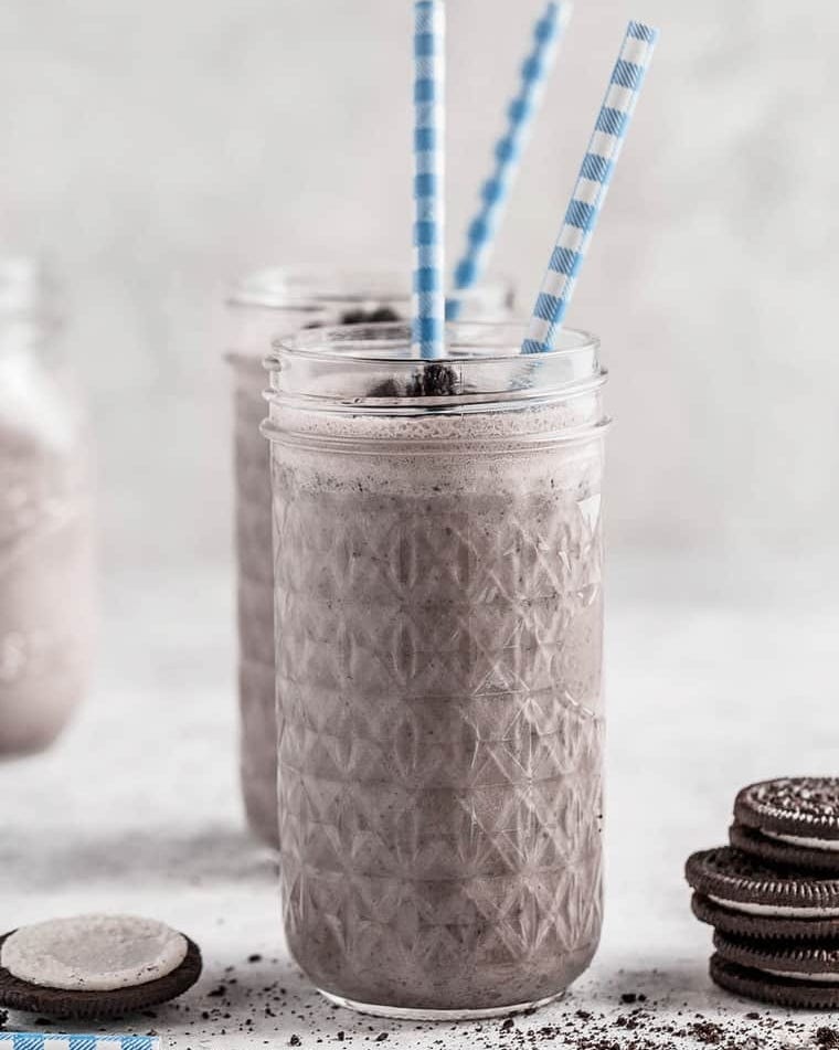 oreo milkshake in glass with blue straw