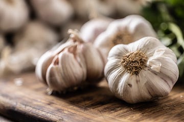 organic garlic unpeeled ready to be used for cooking in the kitchen