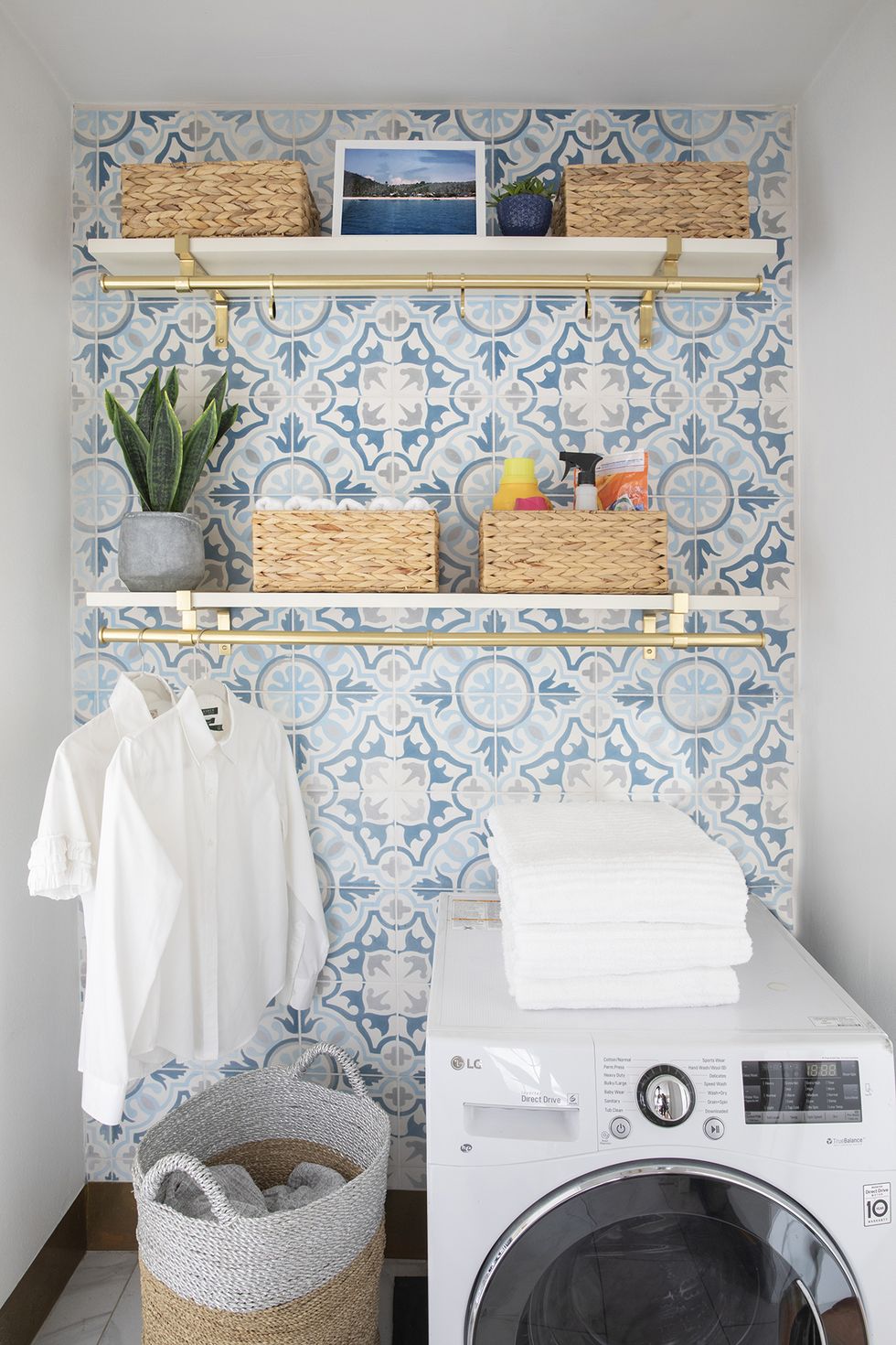 laundry room with geometric wall tiles