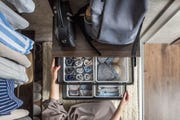 a person pulls out a drawer