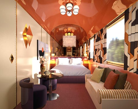 luxurious train cabin interior featuring a bed seating area and decorative elements