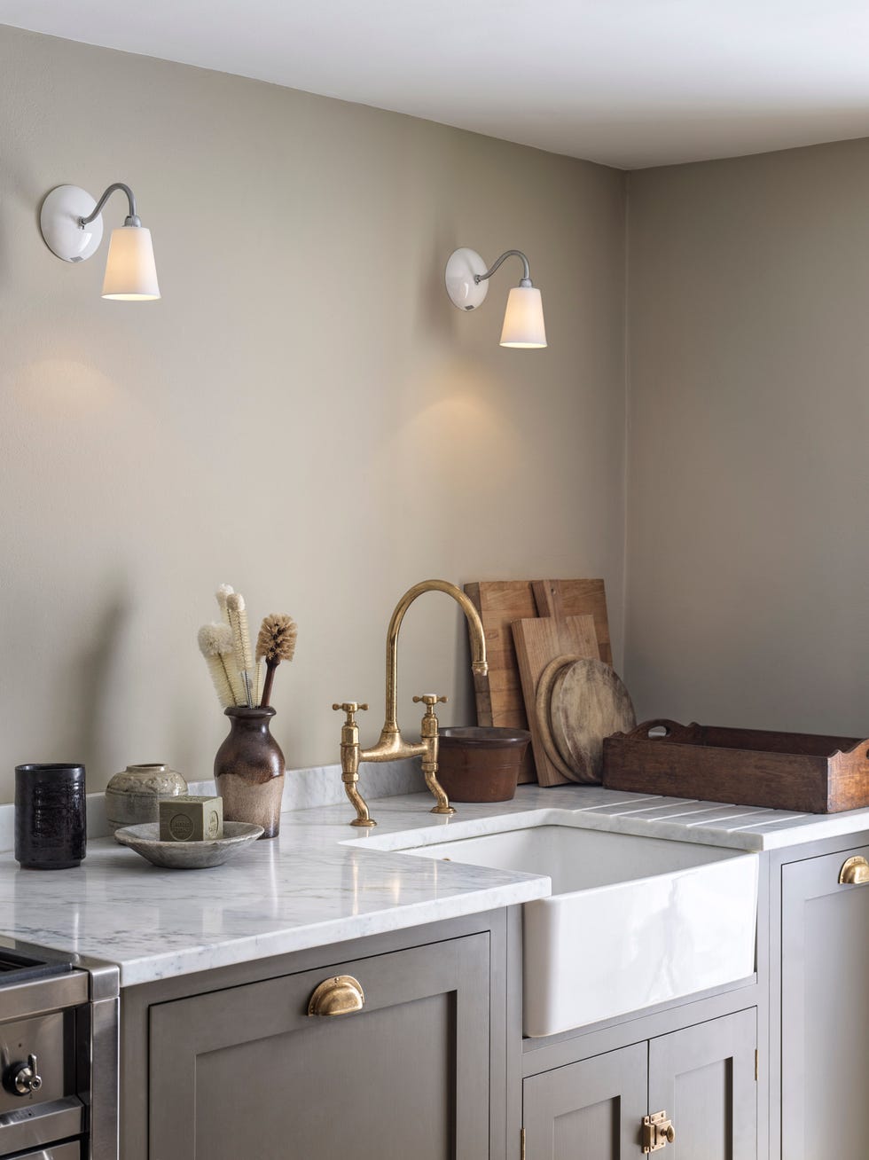 a marble kitchen countertop and original btc wall lights