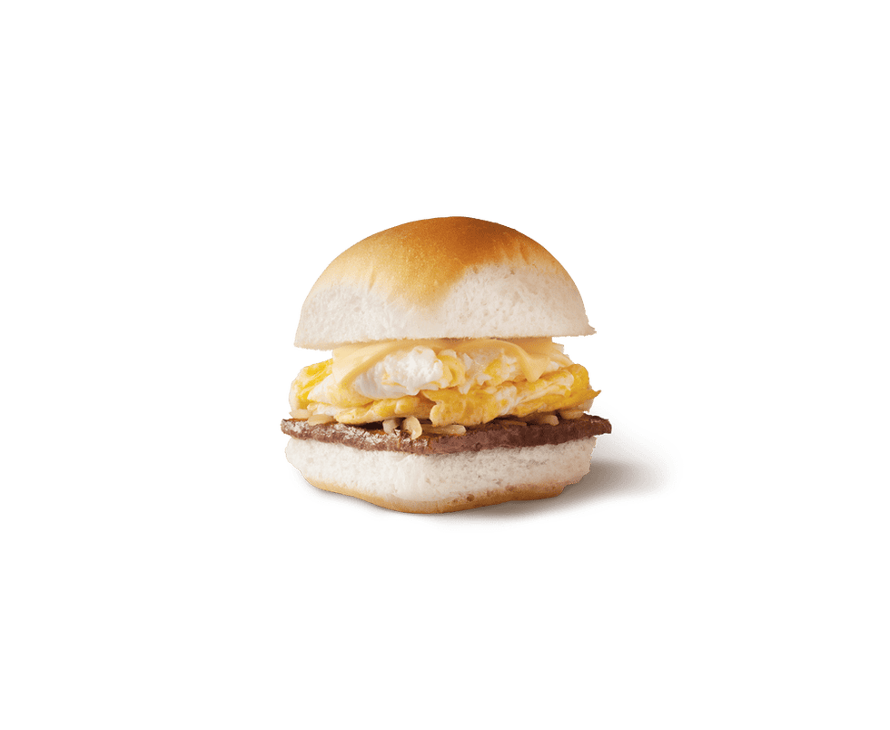 breakfast sandwich featuring eggs and beef patty