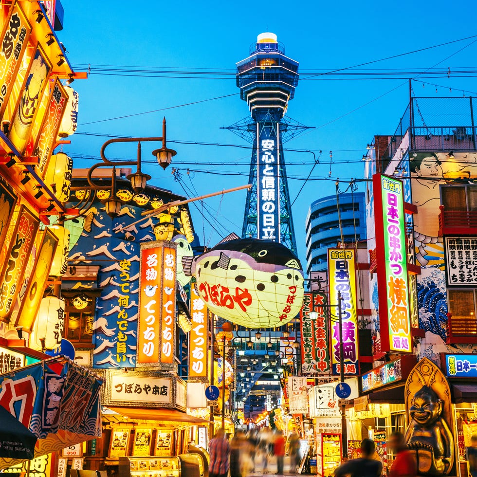 osaka tower and view of the neon advertisements shinsekai district