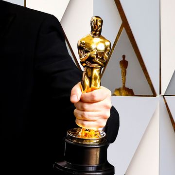 Oscar award in hand