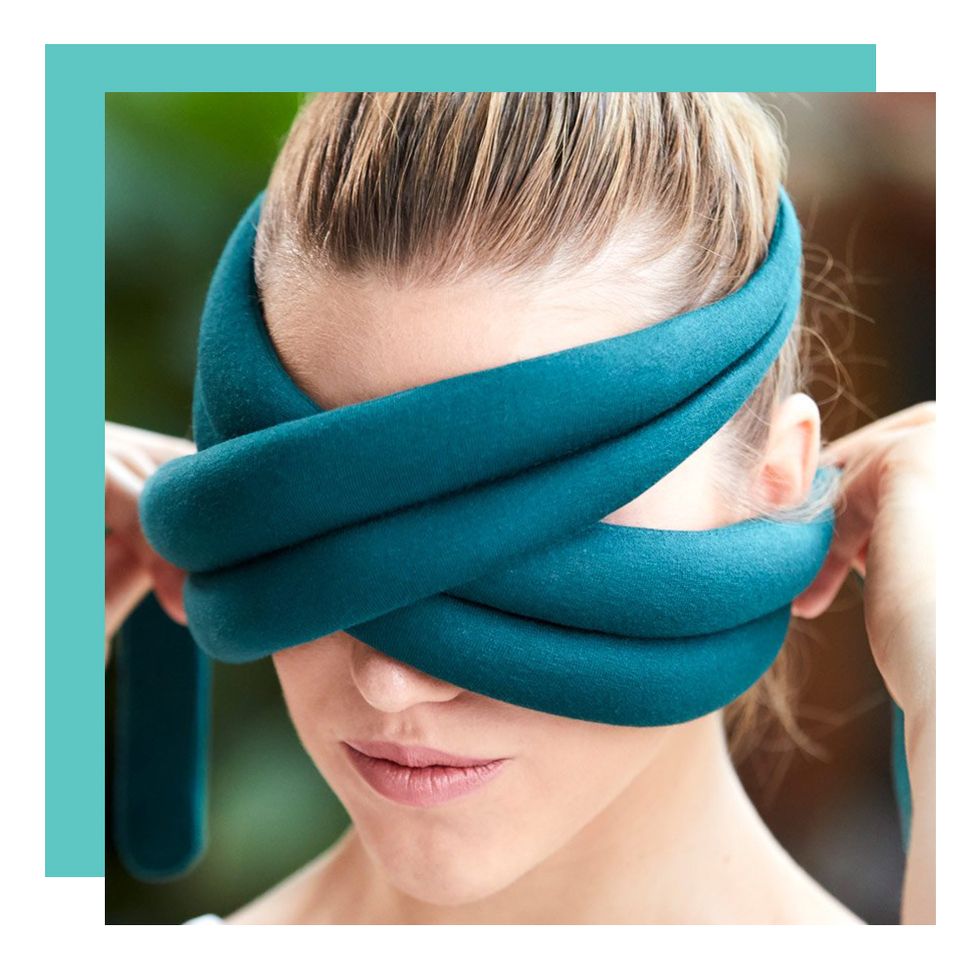 woman wrapping ostrichpillow around eyes