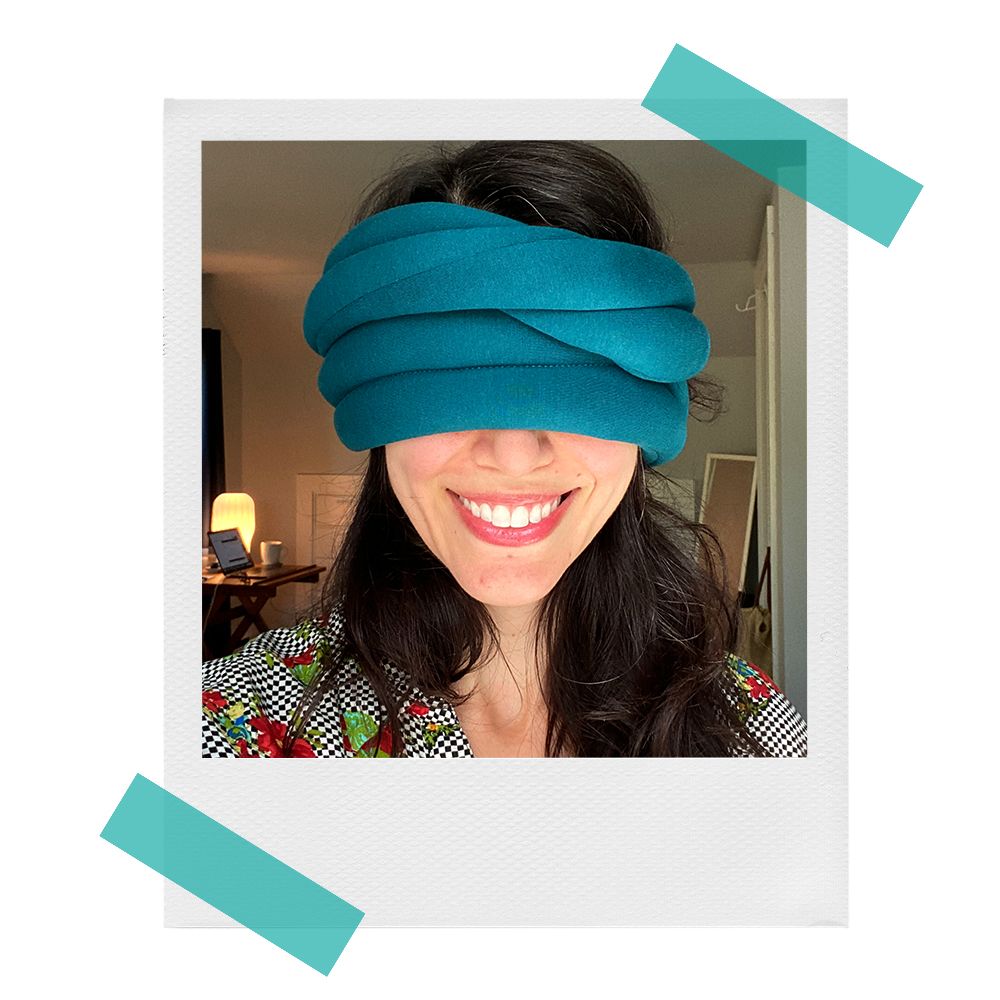 ostrich loop pillow wrapped around melanie's eyes