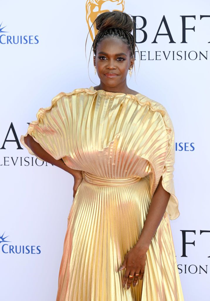 Oti Mabuse shines at the BAFTAS in stunning gold gown