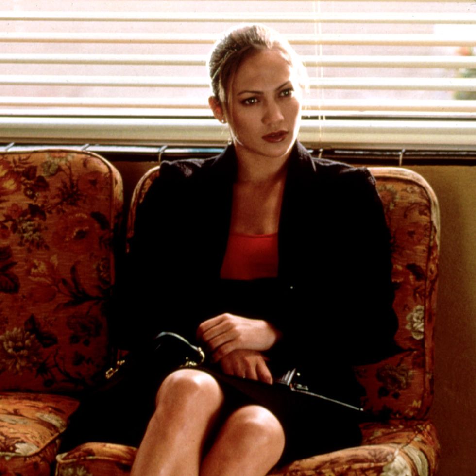 jlo sitting on a couch