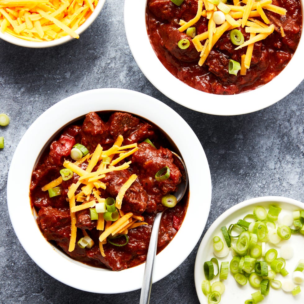 outback steakhouse tasmanian chili topped with shredded cheese and sliced green onions