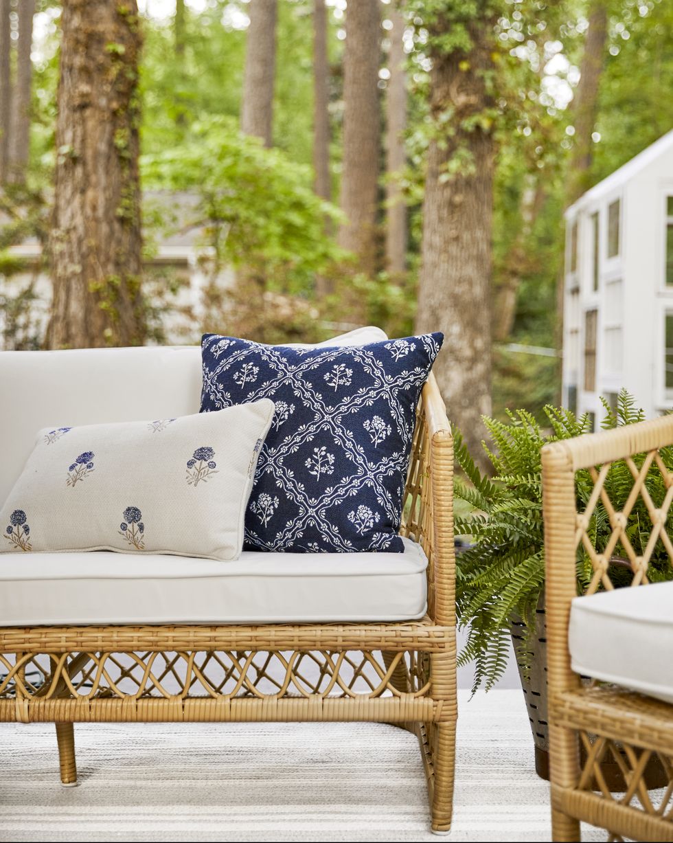 outdoor furniture with blue and white sunbrella pillows