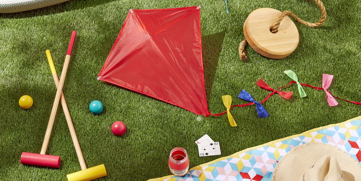 outdoor games and activities above ground pool, tree swing, kite, picnic quilt, lawn game